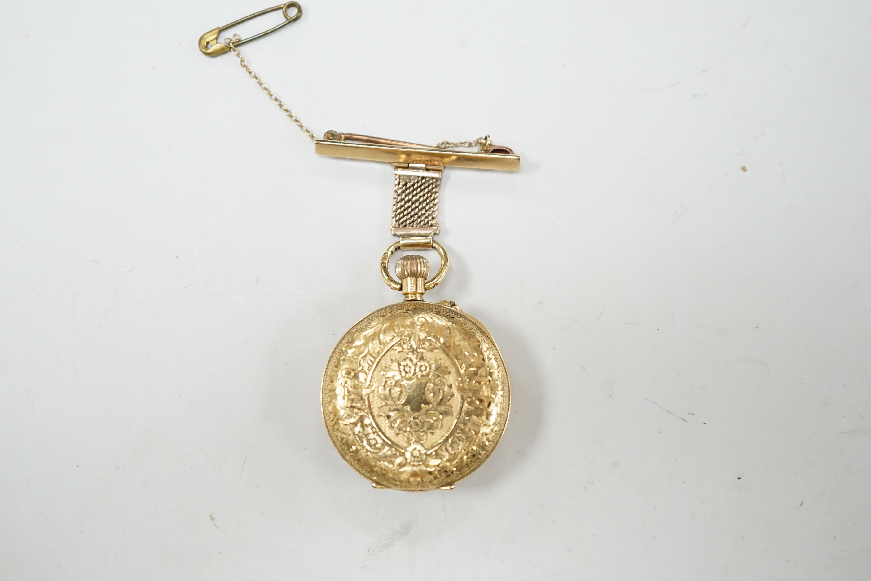 An early 20th century 18ct gold open face fob watch, with Roman dial, on a 9ct suspension brooch, gross weight 27.5 grams.